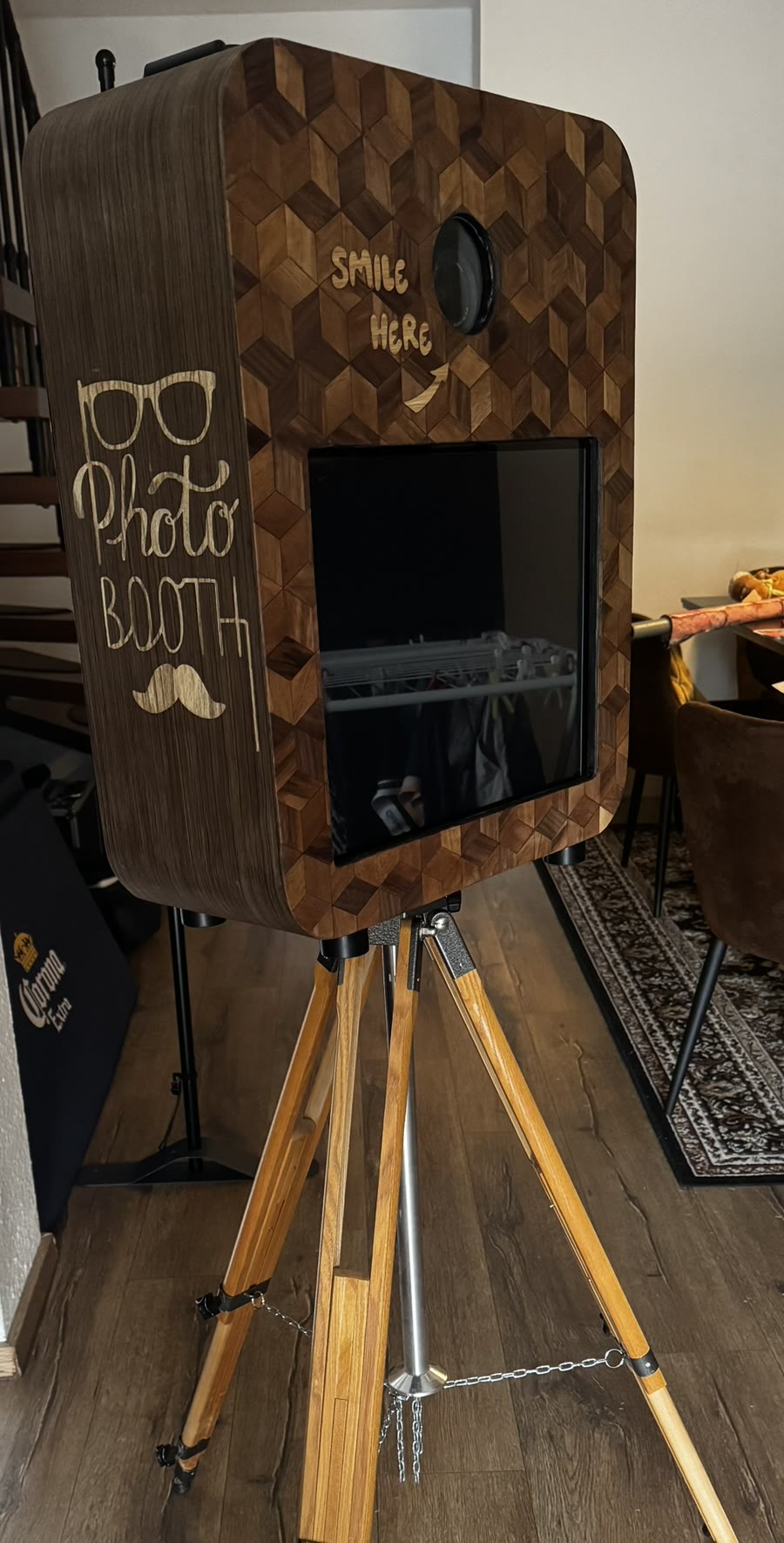 Vintage photo booth by DJ Bülo on a wooden tripod, housing veneered in a cube pattern with the words Photo Booth